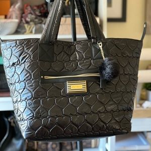 A large Betsy Johnson hobo bag